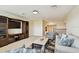 Spacious living room with plush seating and entertainment center at 1140 Terralago Way, Kissimmee, FL 34746