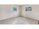 Bedroom featuring tile floor with neutral wall color and bright natural light at 1212 Blake Ave, Auburndale, FL 33823