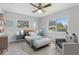 Comfortable bedroom with bed, nightstands, and windows offering natural light at 1212 Blake Ave, Auburndale, FL 33823