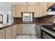 Functional kitchen design showcasing tile countertops and classic light-colored cabinetry at 1212 Blake Ave, Auburndale, FL 33823