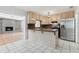 Cozy kitchen design with breakfast bar, offering views into the adjoining living room at 1212 Blake Ave, Auburndale, FL 33823