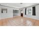 Spacious living room with tile floors and natural light from multiple windows at 1212 Blake Ave, Auburndale, FL 33823