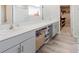 Spacious bathroom featuring a double vanity, ample storage, and a walk-in closet at 1424 Axel Cir, Winter Haven, FL 33880