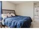 Cozy bedroom with a blue comforter and a view to the door at 1424 Axel Cir, Winter Haven, FL 33880