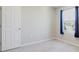 Neutral bedroom with carpet and a window with blue curtains allows for customization at 1424 Axel Cir, Winter Haven, FL 33880