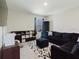 Comfortable living room with a large sectional, decorative rug, and ample storage at 1424 Axel Cir, Winter Haven, FL 33880