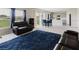 Open living area with modern furnishings, dining table, and view into a kitchen with stainless steel appliances at 1424 Axel Cir, Winter Haven, FL 33880
