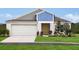 Charming single-Gathering home with a two-car garage and inviting curb appeal at 1716 Vanilla St, Haines City, FL 33844
