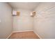 A functional walk-in closet with carpet, shelving, and hanging racks at 1716 Vanilla St, Haines City, FL 33844