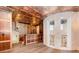 Unique basement with textured copper ceiling, a bar area, stone walls and hardwood floors exudes character at 952 Moss Ln, Winter Park, FL 32789