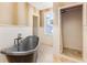 Bathroom with freestanding tub and tiled shower at 952 Moss Ln, Winter Park, FL 32789