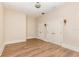 Airy bedroom with two doors, wood floors, sconce lighting, and neutral walls creates a clean and versatile living space at 952 Moss Ln, Winter Park, FL 32789