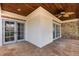 Inviting covered patio with wood ceiling, tile flooring, and comfortable outdoor seating area at 952 Moss Ln, Winter Park, FL 32789