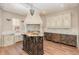 Charming kitchen with custom cabinets, central island, marble countertops, and a striking blue oven range at 952 Moss Ln, Winter Park, FL 32789