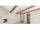Bright living room with wood beam ceiling, fireplace and doorway at 952 Moss Ln, Winter Park, FL 32789
