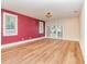 Brightly lit main bedroom with a walk out deck, and hardwood flooring at 952 Moss Ln, Winter Park, FL 32789