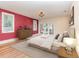 Brightly lit main bedroom with a walk out deck, hardwood flooring, and simple furnishings at 952 Moss Ln, Winter Park, FL 32789