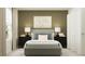 Inviting bedroom with a comfortable bed, soft lighting, and neutral tones at 1060 Hour Glass Rd, Lakeland, FL 33801
