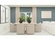 Bright dining room features stylish chairs, an elegant table, and neutral decor at 1060 Hour Glass Rd, Lakeland, FL 33801