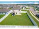 Aerial view of the backyard, featuring a well-maintained lawn and privacy fence at 1508 Majestic Ln, Winter Haven, FL 33880