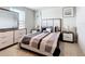 Cozy bedroom with elegant decor, decorative pillows on bed, and matching nightstands at 1508 Majestic Ln, Winter Haven, FL 33880