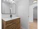 Modern bathroom with stylish vanity, rectangular mirror and updated fixtures at 19795 Sw 85Th Loop, Dunnellon, FL 34432
