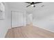 Bedroom with closet and light wood-look flooring at 19795 Sw 85Th Loop, Dunnellon, FL 34432