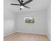 Bright bedroom with a ceiling fan and window at 19795 Sw 85Th Loop, Dunnellon, FL 34432