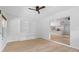 Bonus room with built-in shelving and an open layout, connecting to the kitchen and other living spaces at 19795 Sw 85Th Loop, Dunnellon, FL 34432