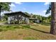 Charming single-story home with mature trees and well-maintained landscaping enhances curb appeal and outdoor beauty at 19795 Sw 85Th Loop, Dunnellon, FL 34432