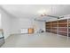 Spacious garage with storage space and an automatic garage door at 19795 Sw 85Th Loop, Dunnellon, FL 34432