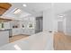 Kitchen with stainless appliances, stone fireplace, and breakfast bar at 19795 Sw 85Th Loop, Dunnellon, FL 34432