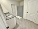 Bathroom featuring a double vanity with granite countertop and tiled flooring at 3148 Caspian Feather St, Bartow, FL 33830