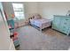 Cozy bedroom with plush carpet, natural light, and playful décor at 3148 Caspian Feather St, Bartow, FL 33830