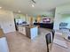 Modern kitchen island with granite countertops, stainless steel appliances, and seating for casual dining at 3148 Caspian Feather St, Bartow, FL 33830