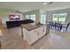 Open floorplan kitchen with granite island, stainless appliances, and adjacent dining area at 3148 Caspian Feather St, Bartow, FL 33830
