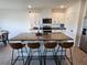 Bright kitchen with an island that has seating and lots of countertop space next to the stainless steel appliances at 3148 Caspian Feather St, Bartow, FL 33830