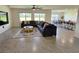 Spacious living room with tile flooring, comfortable seating, and view of the outdoors at 3148 Caspian Feather St, Bartow, FL 33830