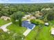 An aerial view of the home shows the manicured lawn, established landscaping and the quiet neighborhood at 3331 Lime Tree Dr, Edgewater, FL 32141