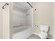 Bright bathroom with a jacuzzi tub, white toilet, chrome hardware and neutral walls at 3331 Lime Tree Dr, Edgewater, FL 32141