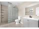Updated bathroom features glass block shower, modern vanity, and neutral color palette at 3331 Lime Tree Dr, Edgewater, FL 32141