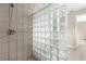 Close up of the glass blocked shower in the renovated bathroom at 3331 Lime Tree Dr, Edgewater, FL 32141