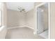 Simple bedroom with tile flooring, ceiling fan, and adjacent to other rooms at 3331 Lime Tree Dr, Edgewater, FL 32141