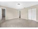Spacious bedroom with tiled floors, closet, and entry to the bathroom at 3331 Lime Tree Dr, Edgewater, FL 32141