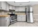 Open kitchen featuring shaker cabinets, mosaic backsplash, wooden countertops and stainless steel appliances at 3331 Lime Tree Dr, Edgewater, FL 32141