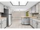 Bright kitchen featuring shaker cabinets, mosaic backsplash, and stainless steel appliances at 3331 Lime Tree Dr, Edgewater, FL 32141