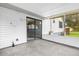 A screened lanai with concrete flooring is accessible through glass sliding doors from inside the home at 3331 Lime Tree Dr, Edgewater, FL 32141