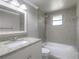 This bathroom features a granite-look vanity top and updated tile in the shower and backsplash at 3550 Keen Dr, Mulberry, FL 33860