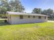 Exterior view of the back of the property showing the rear lawn at 3550 Keen Dr, Mulberry, FL 33860