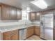 Updated kitchen with stainless steel appliances, granite counters and ample storage space at 3550 Keen Dr, Mulberry, FL 33860
